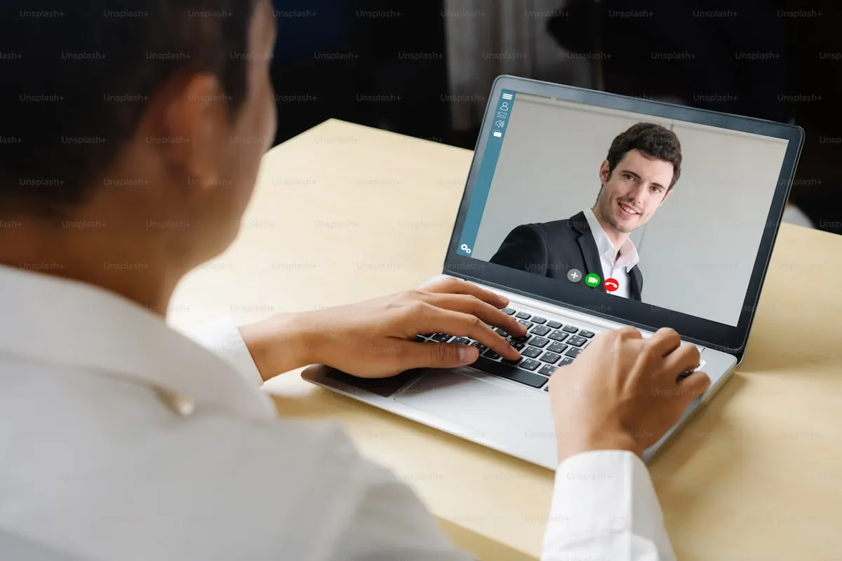 Professional in a video interview on a laptop screen