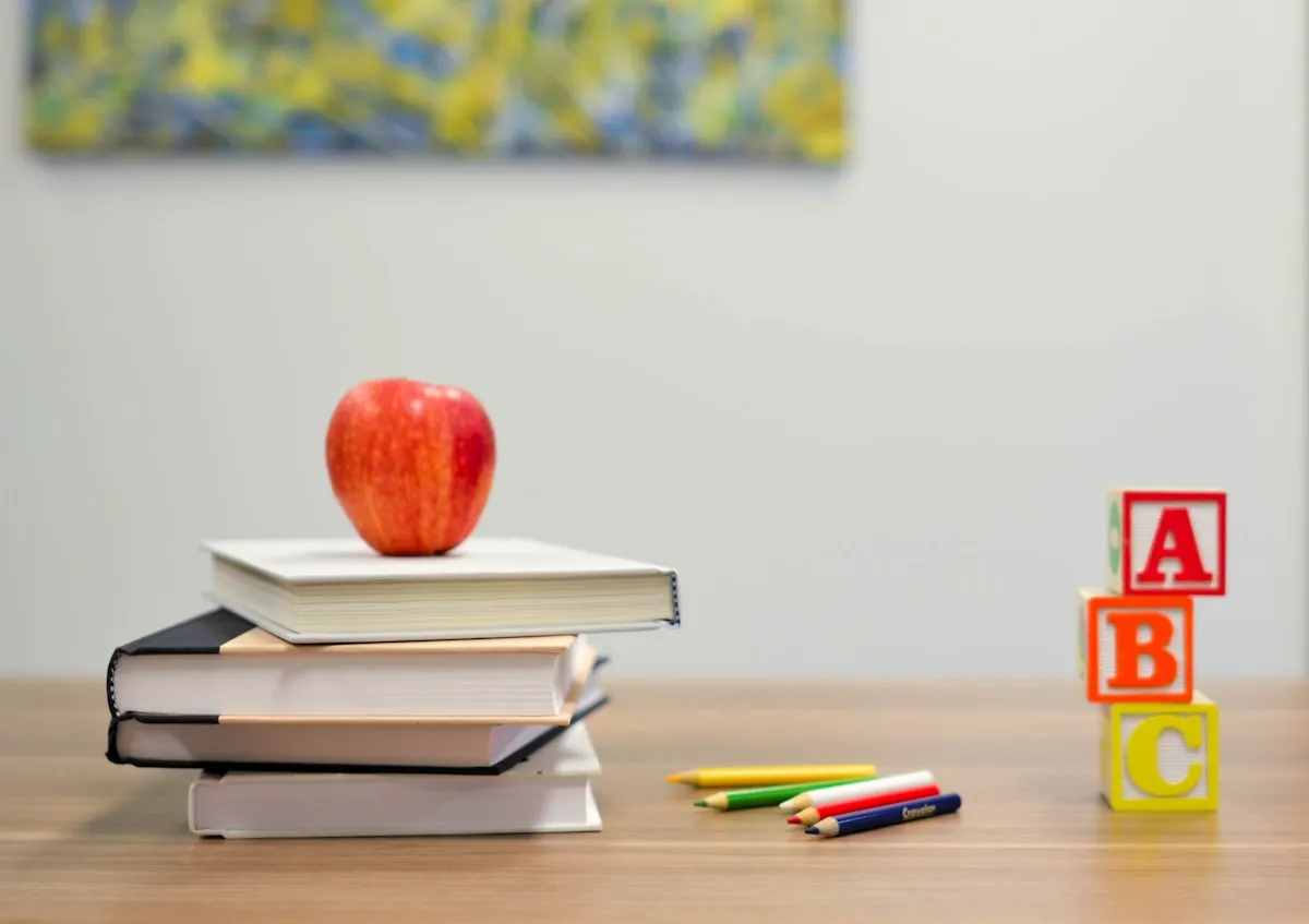 Child reading a book in a classroom setting | Photo by Unsplash