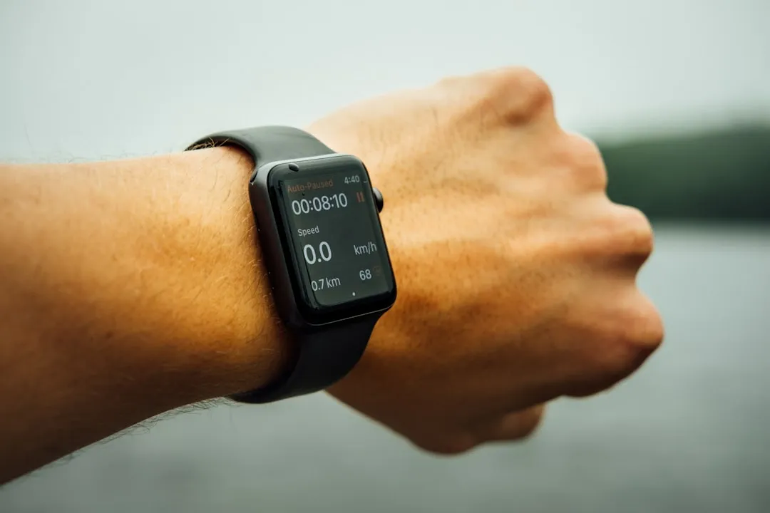 space gray aluminum case Apple watch | Photo by Tim Foster on Unsplash